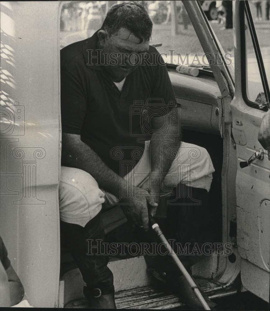 1968 Polo player Harold Barry resting in his truck, Milwaukee - Historic Images