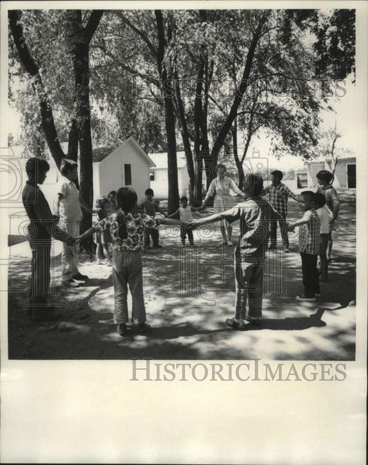 1967, Mrs. Shupe cares for migrant workers' children - mjc27796 - Historic Images