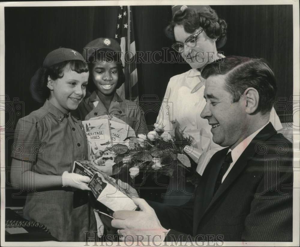 1962, Mayor Maier receives cookies from Girl Scouts in Milwaukee - Historic Images