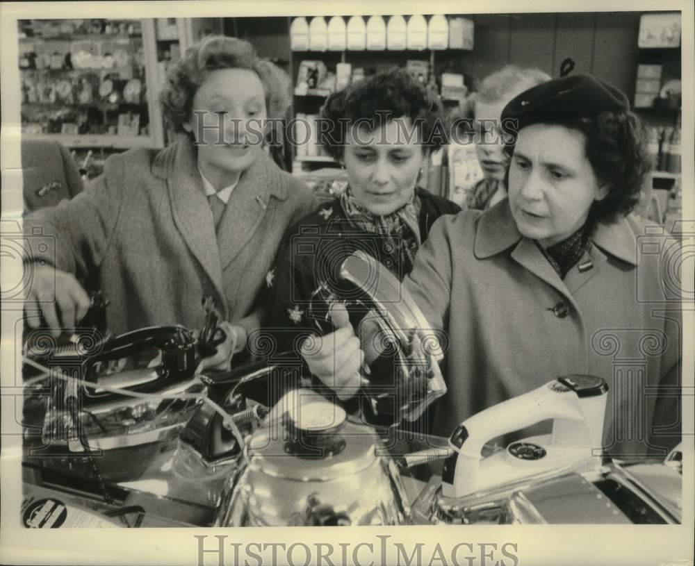 1957, Hungarian refugees shopping at store in Power River - mjc28239 - Historic Images