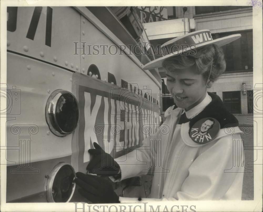 1962 Press Photo Mrs. Karl Ahlen puts Republican candidate sticker on a bus - Historic Images