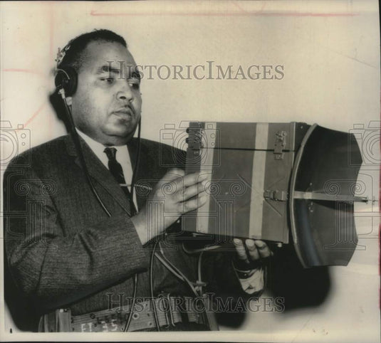 1962, Harold Tate demonstrating a hand held radar device, New Jersey - Historic Images