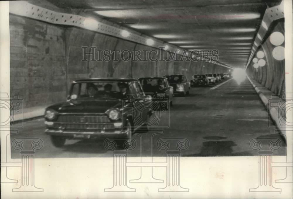 1964 Press Photo Cars drive the new Alps tunnel between Italy and Switzerland- Historic Images