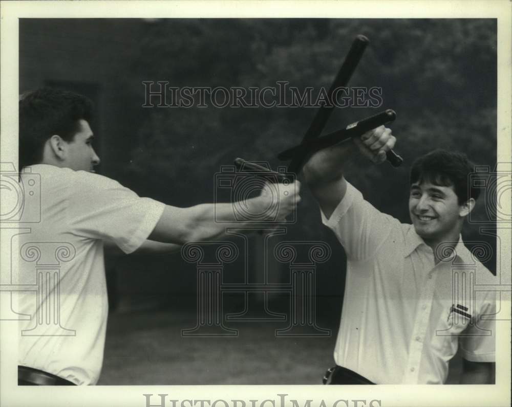 1983 Press Photo Training students demonstrate new police baton, the Prosecutor - Historic Images