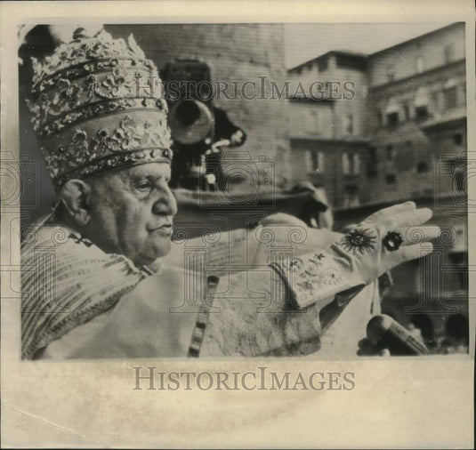 1958, Pope John XXIII blessing the crowd outside St. Peter's basilica - Historic Images