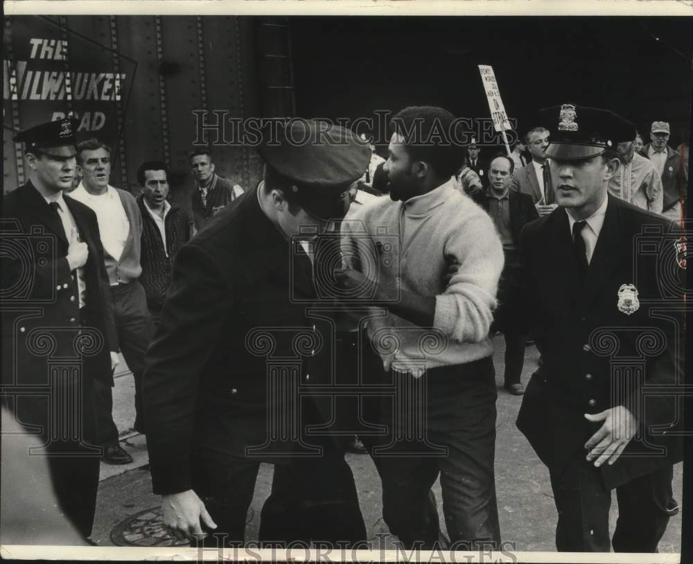 1969, Man arrested at Strike at Jos Schlitz Brewing Company Milwaukee - Historic Images