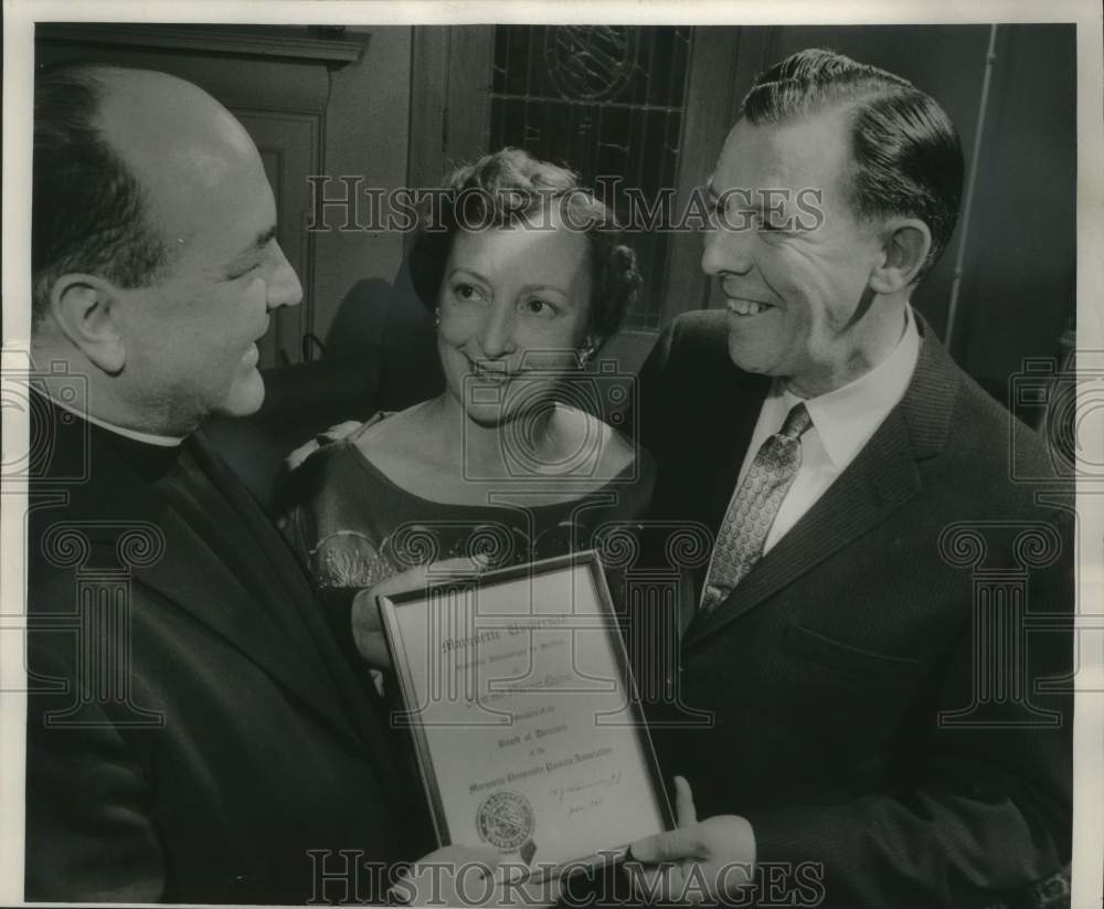 1959 Mr. &amp; Mrs John Quinn receiving award from Marquette University - Historic Images