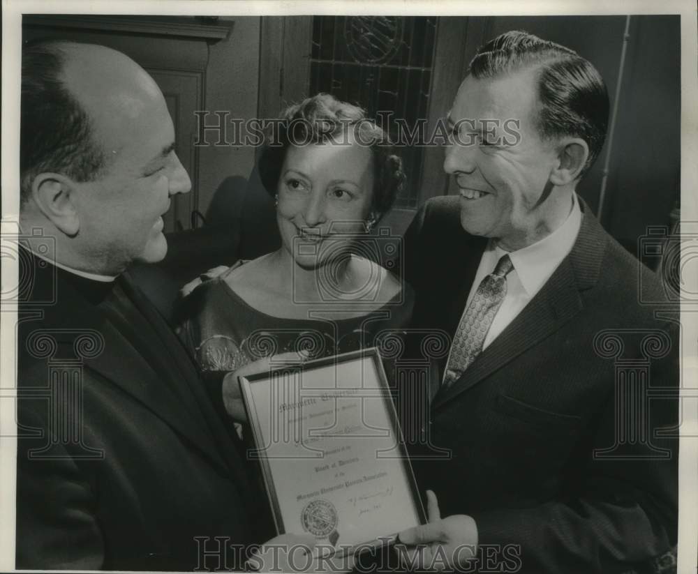 1959 Mr. & Mrs John Quinn receiving award from Marquette University - Historic Images