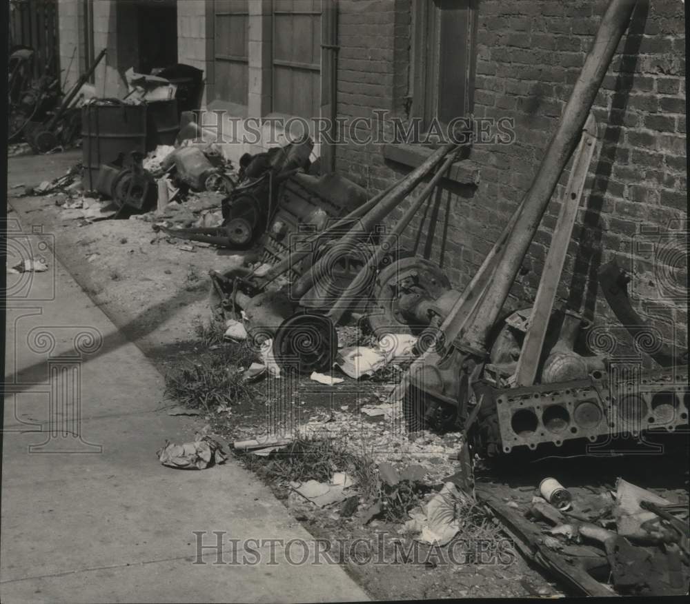 1949, Auto parts and garbage litter alongside a Milwaukee street - Historic Images