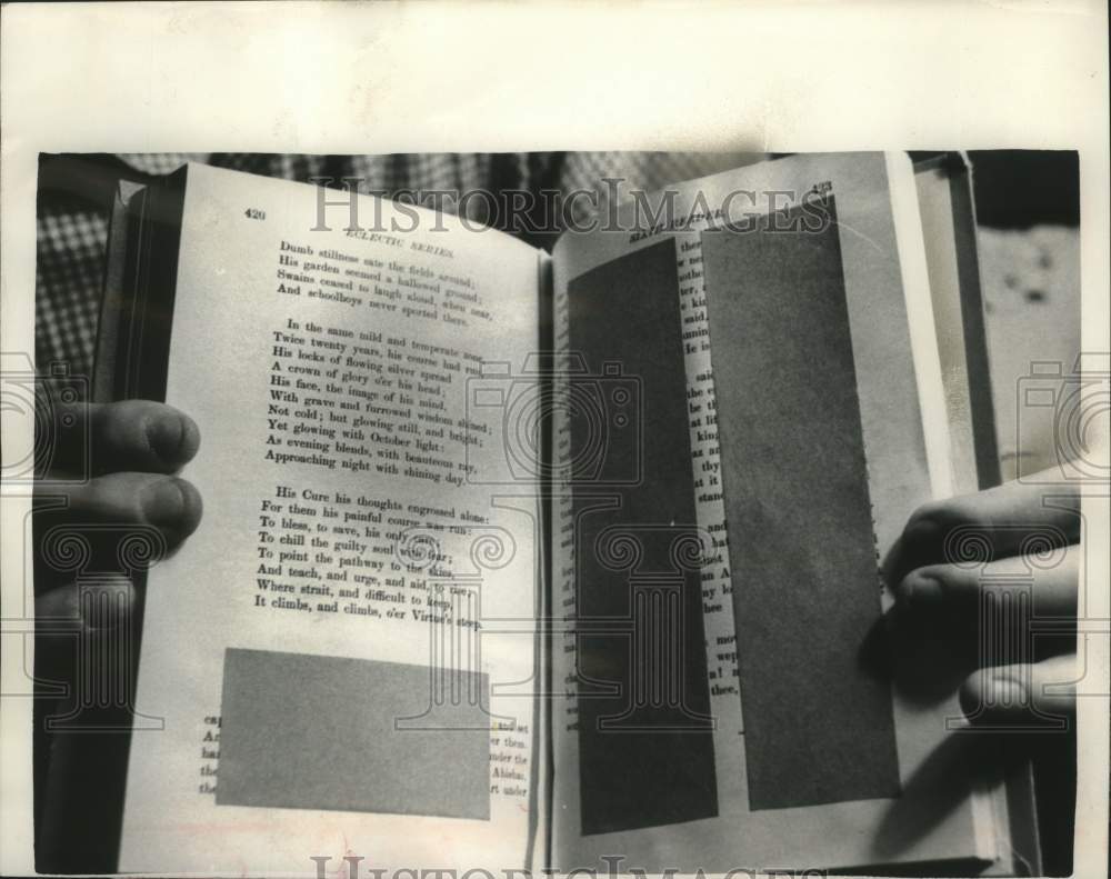 1961 Press Photo Parts of school text book were taped due to religion reference- Historic Images