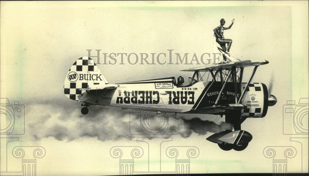 1984 Press Photo Paula Cherry on the wing of a plane at Fly-in, Wisconsin - Historic Images