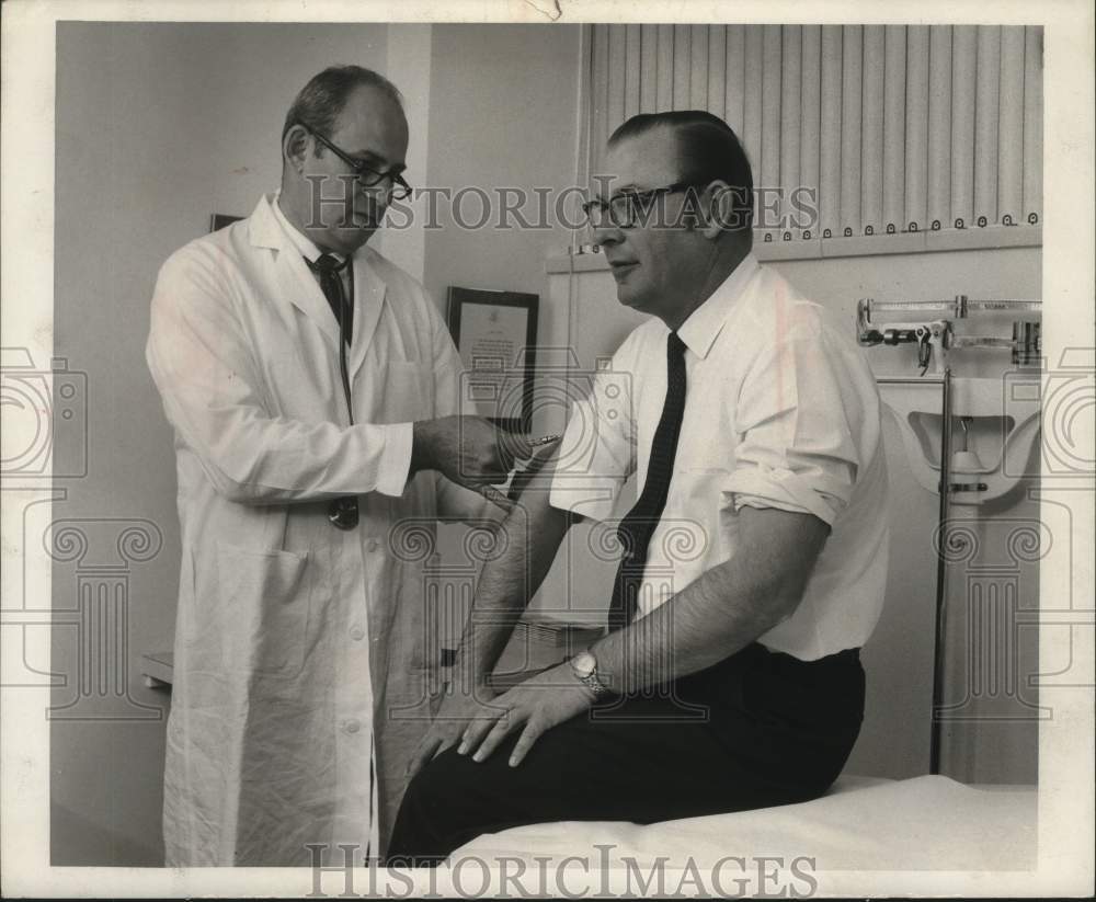1960, WOKY's Bill James, visits Dr. Earle Rotter - mjc29373 - Historic Images
