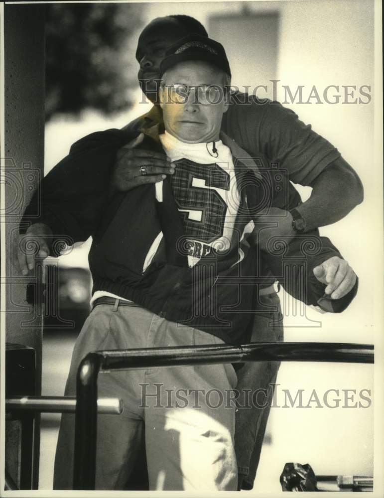 1992 Press Photo Will Shriner is jokingly stopped by Summerfest security guard. - Historic Images