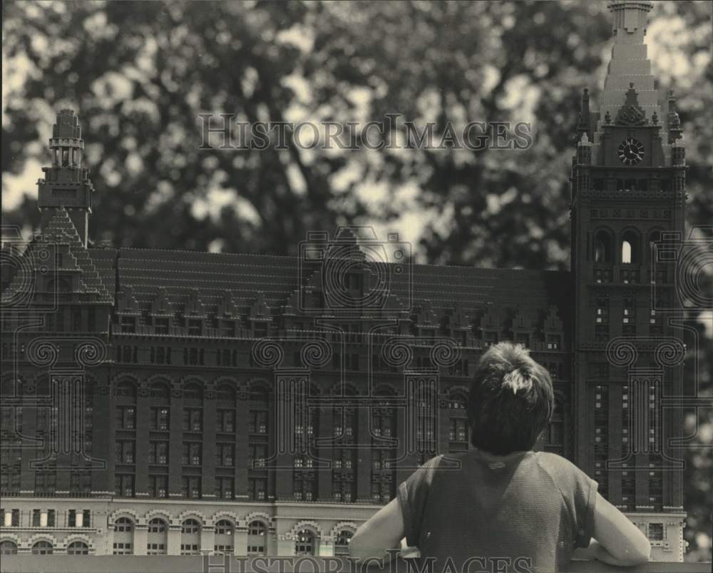 1967, Tony Haffelder looking at model of City Hall, Wisconsin - Historic Images