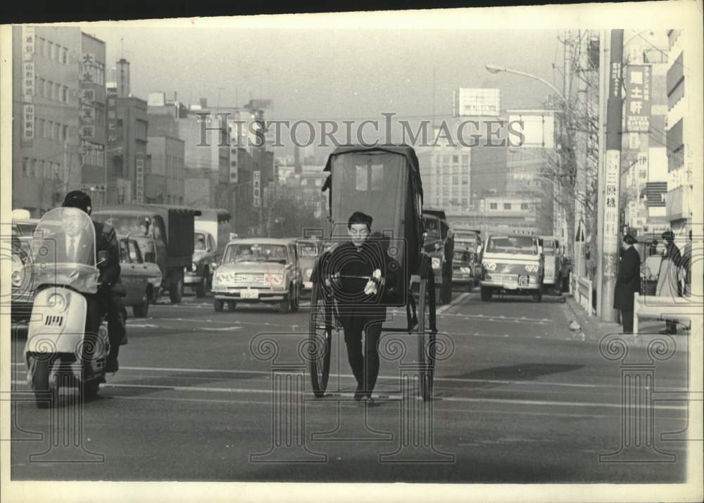 1968, Jinrikisha puller in downtown Tokyo, Japan - mjc30151 - Historic Images