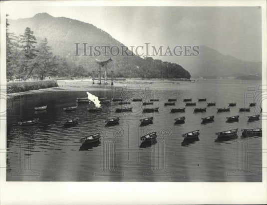 1967, Rowboats in the water near Tori Gate on Japan's Miyajima Island - Historic Images