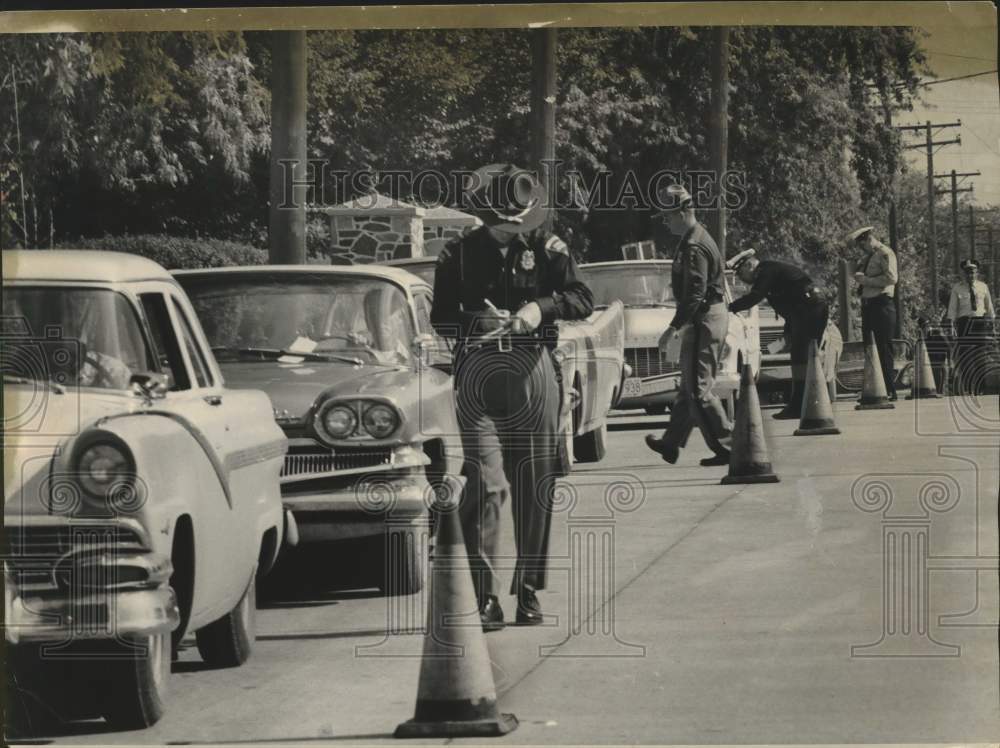1962, Wisconsin State Highway patrolmen safety inspecting vehicles - Historic Images