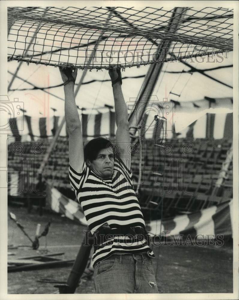 1970, Author George Plimpton hangs from a net - mjc30475 - Historic Images