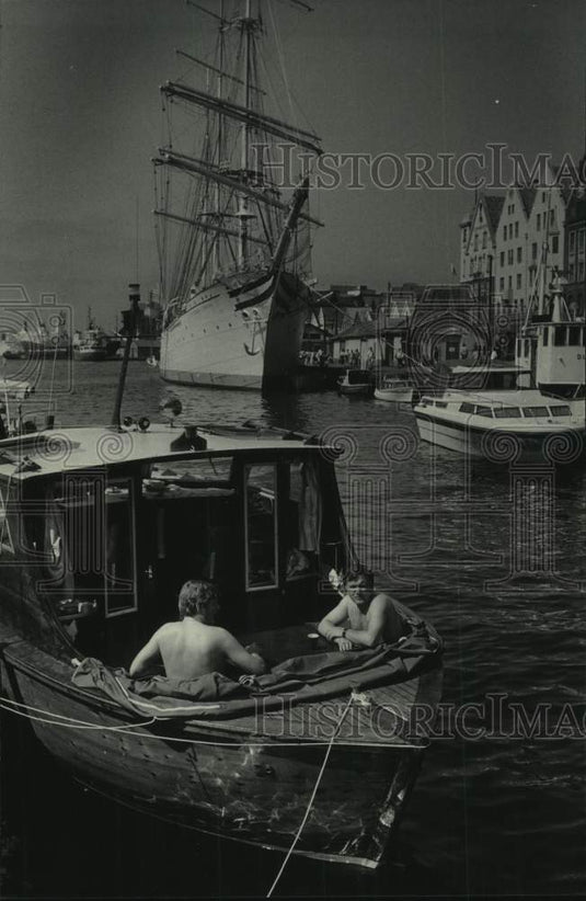 1985 Press Photo Two men on boat in harbor, Bergen, Norway - mjc30683 - Historic Images