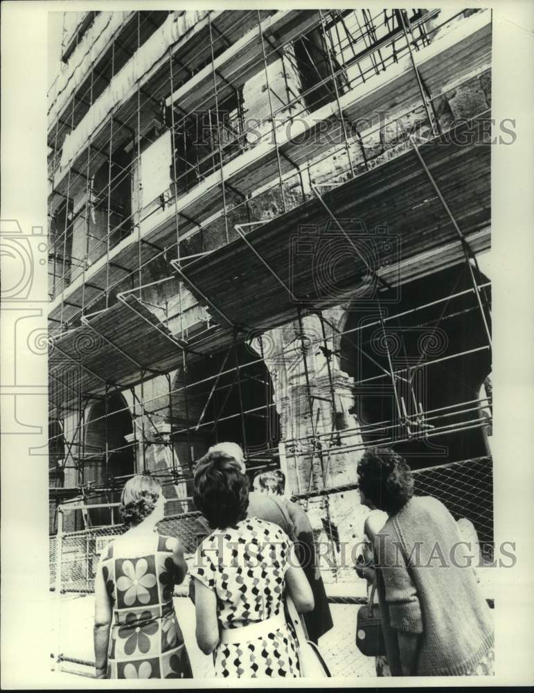 1972, Tourists outside the Colosseum during repairs, Rome, Italy - Historic Images