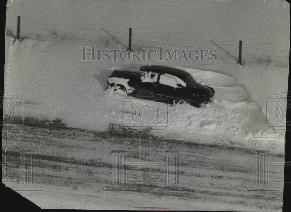1956, Car stuck in snow drift after a snow storm in Wisconsin - Historic Images