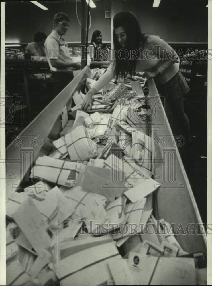 1973 Milwaukee Postal worker Gladys Jaeck sorts mail during holiday - Historic Images