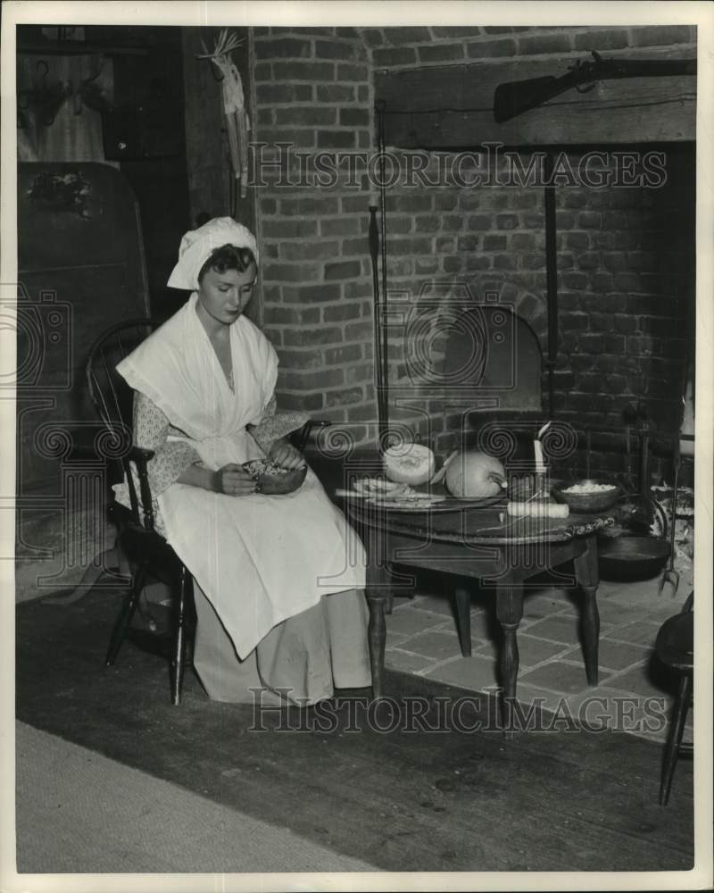 1951 Press Photo Lady Cooking by Candle in Old Sturbridge Reconstructed Home - Historic Images