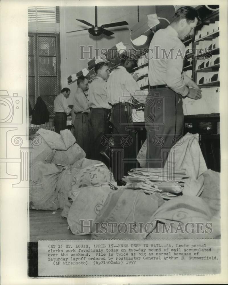 1957 Press Photo Mail processors with mail piled at Saint Louis post o ...