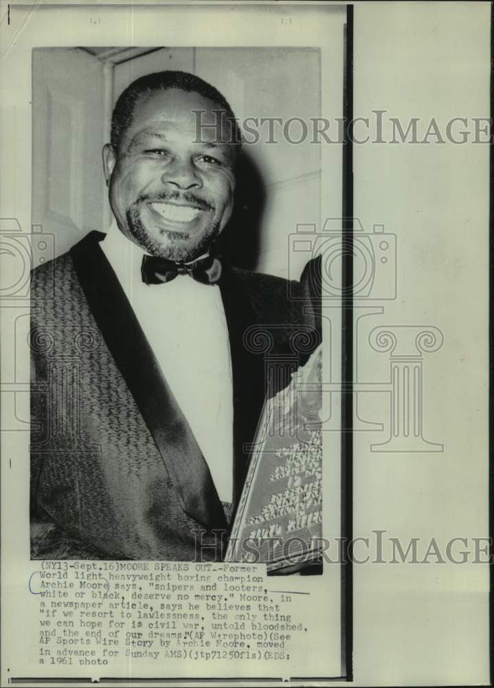 1961 Press Photo Archie Moore, former World light heavyweight boxing champion - Historic Images