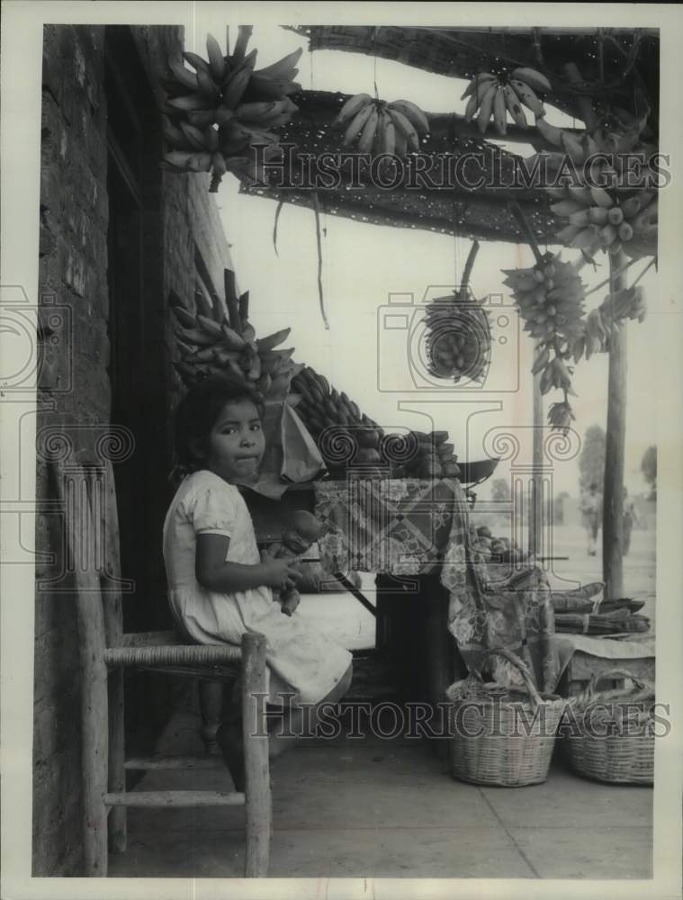 1961, People of Mala, Peru, Young Child Manages Fruit Stand - Historic Images