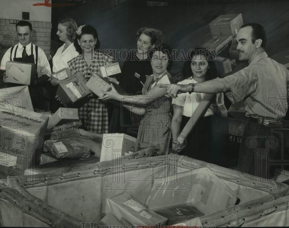 1951, Women sorting parcels for first time in Milwaukee post office. - Historic Images