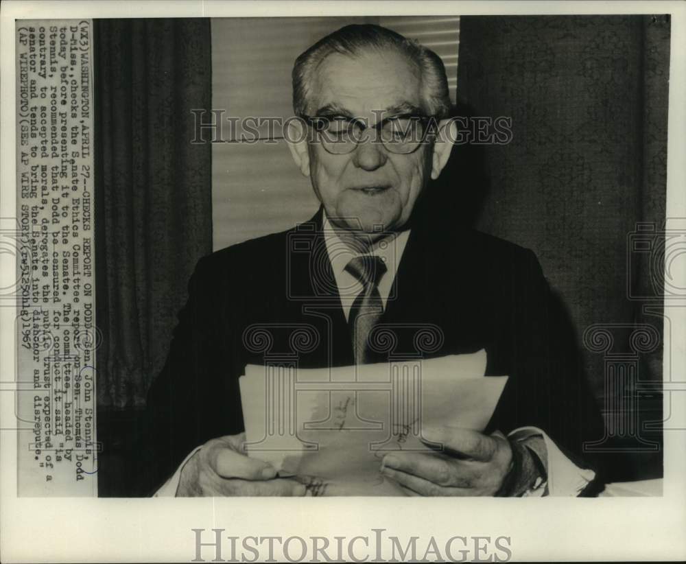 1967, Senator John Stennis reading a report, Washington, D.C. - Historic Images