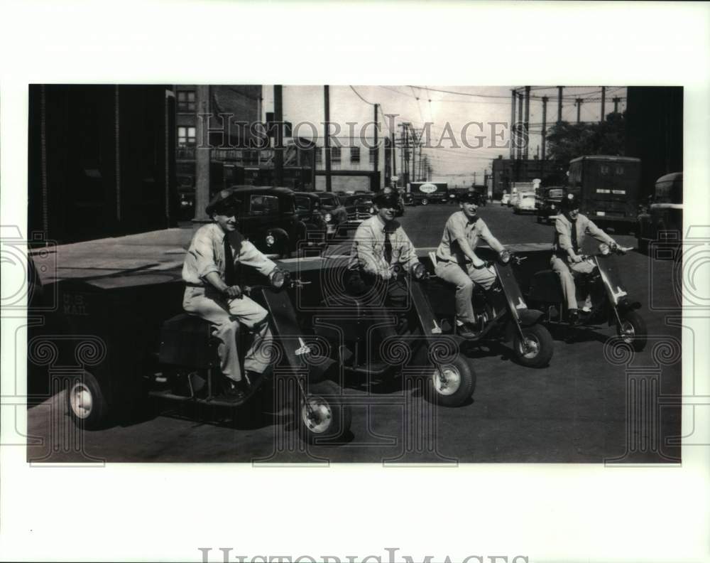 Press Photo Four mail carriers on motor carts in Milwaukee - mjc32429 - Historic Images