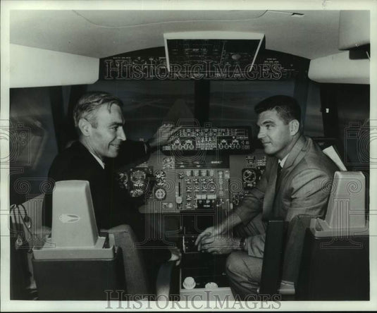 1966, Lockheed Aircraft Corp officials in cockpit at pilot's panel. - Historic Images