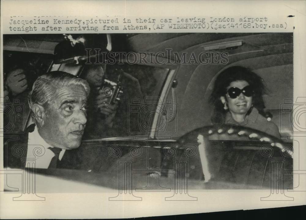 1968, Aristotle Onassis and wife, Jacqueline, leaving London airport - Historic Images