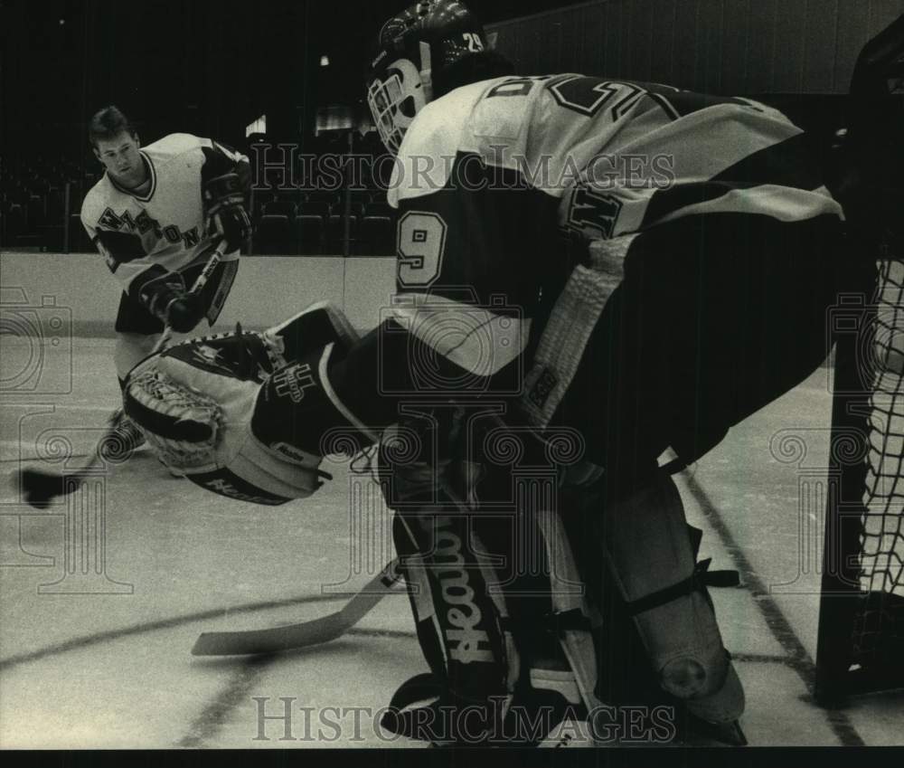 1988 Press Photo Kurt Semandel tried out his shot on goalie Duane Derksen. - Historic Images