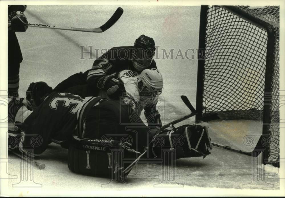 1994 Press Photo Mike Strobel in a pile, Wisconsin & Denver WHCA Hockey Game - Historic Images