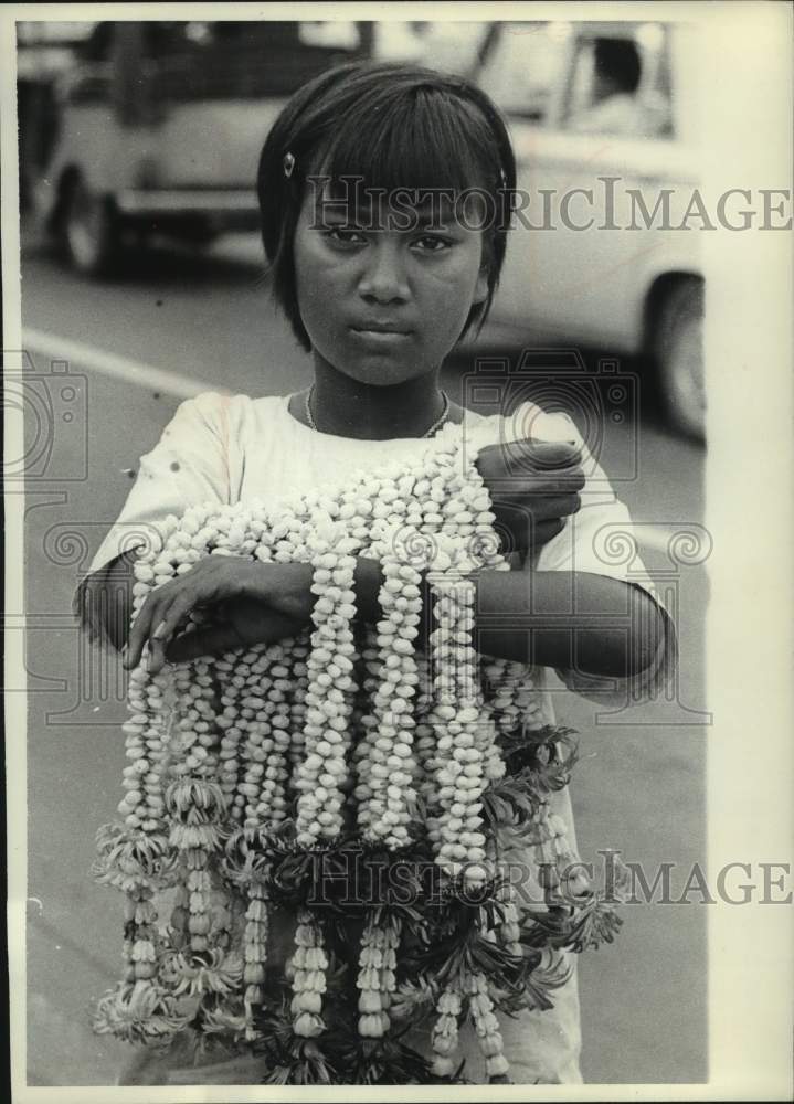 1963, Flower child on the streets of Bangkok, Thailand - mjc34126 - Historic Images