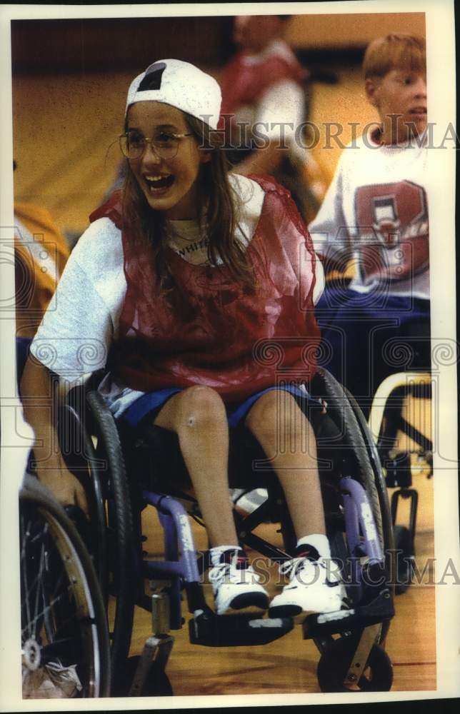 1993 Press Photo Christina Ripp shows her enthusiasm for football in wheelchair - Historic Images