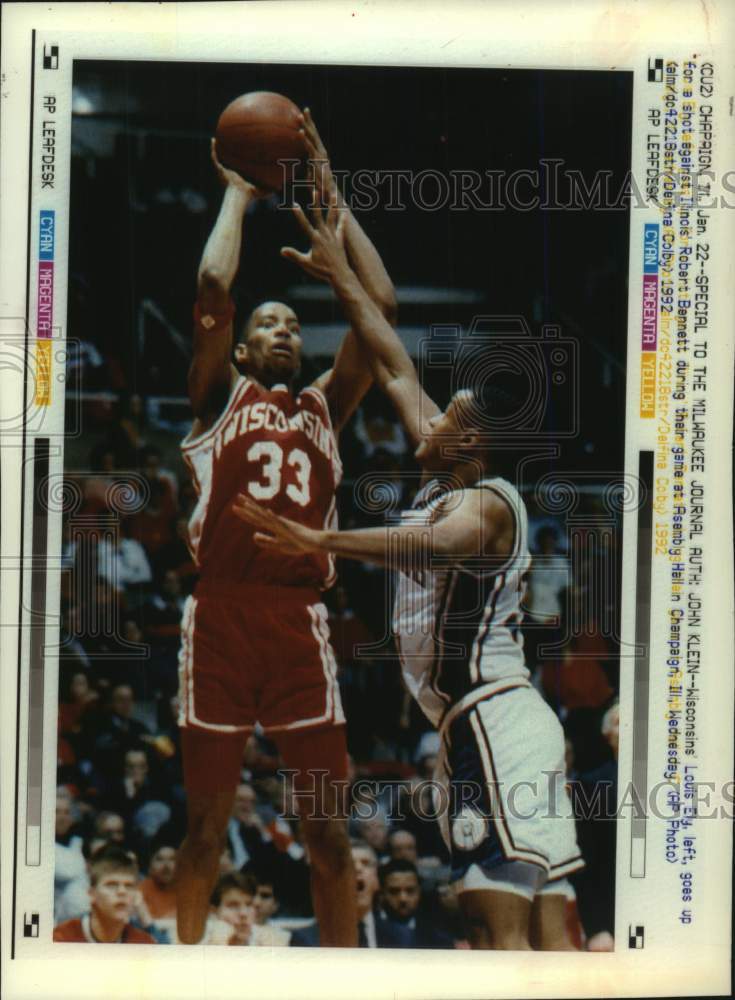 1992 Press Photo Wisconsin University-Madison Basketball player Louis Ely shoots - Historic Images