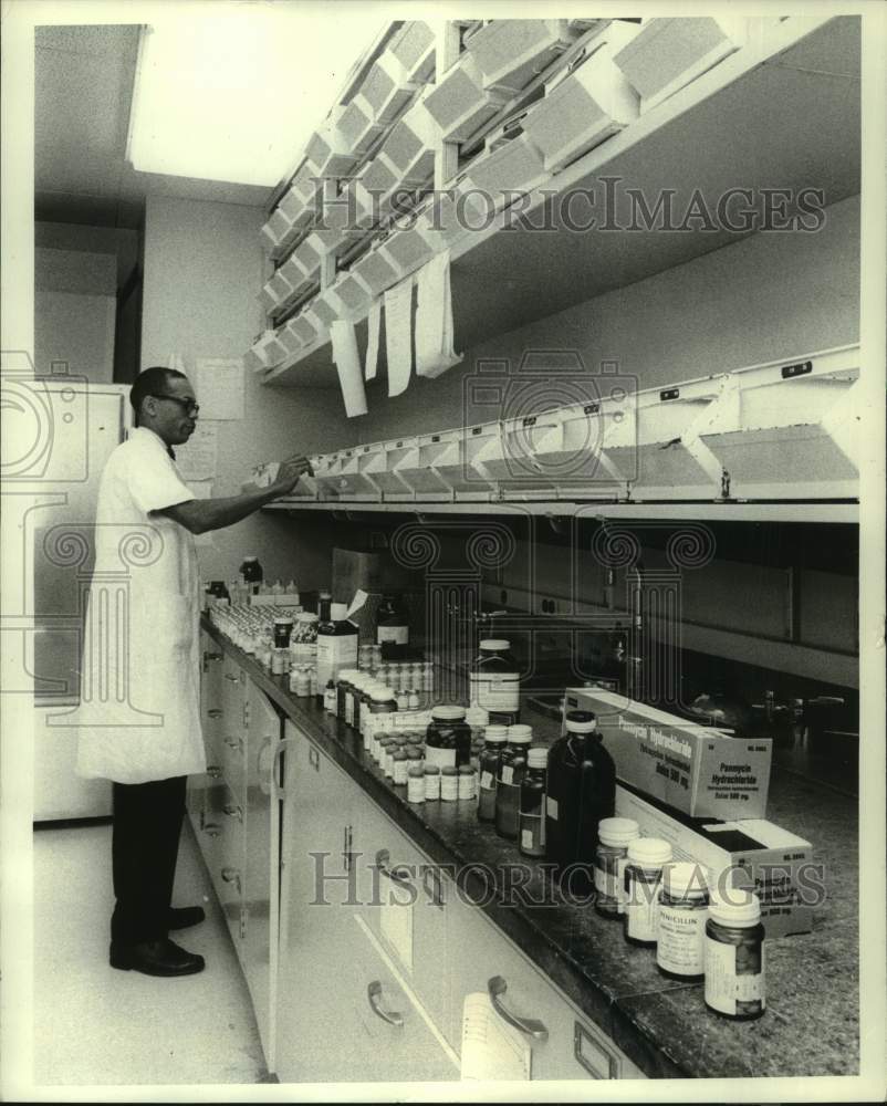 1970 U.S. Food & Drug Administration Chemist Checks Antibiotics - Historic Images