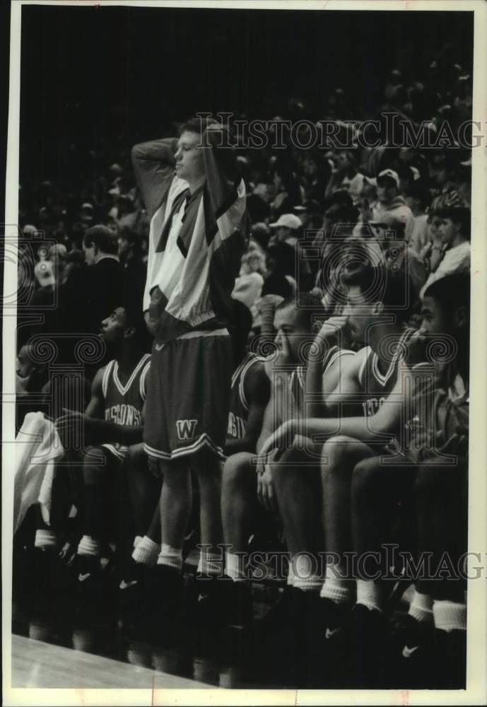 1994 Badger basketball's Chris Conger reacts to missed shot at game. - Historic Images