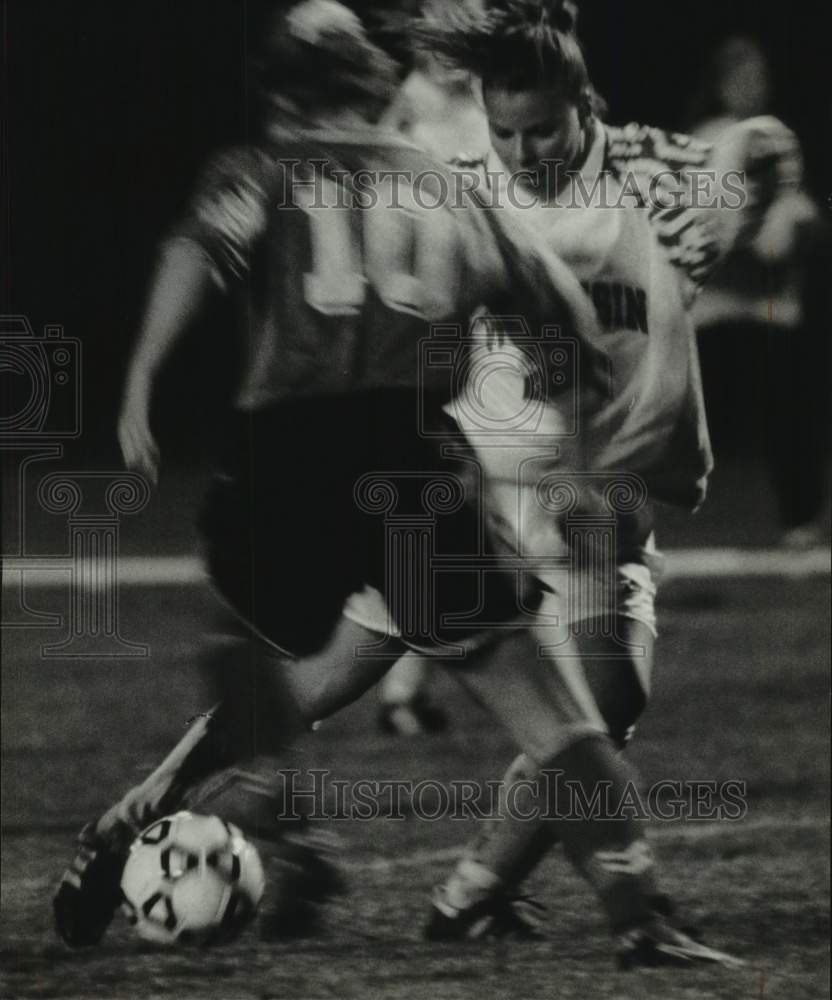 1994, Heather Meier working soccer ball past opponent, Wisconsin - Historic Images