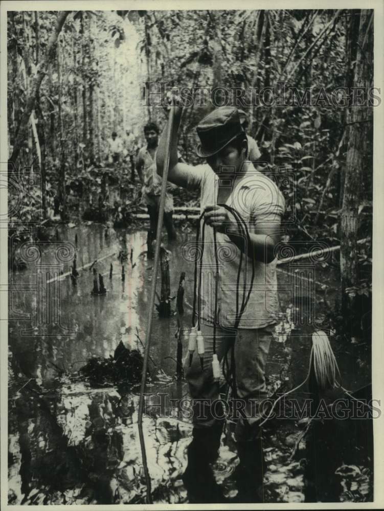 1974, Peruvian oil worker searching for oil in Peru - mjc34590 - Historic Images