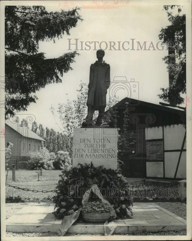 1959, Powerful statue stands in courtyard, Dachau concentration camp - Historic Images