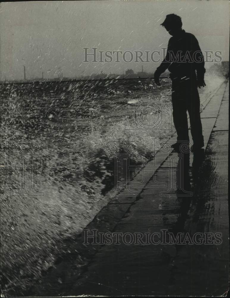 1953, A boy get splattered by the waves of Lake Michigan. - mjc35173 - Historic Images