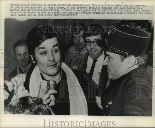 1969, French star Alvin Delon arrives at police headquarter in Paris. - Historic Images
