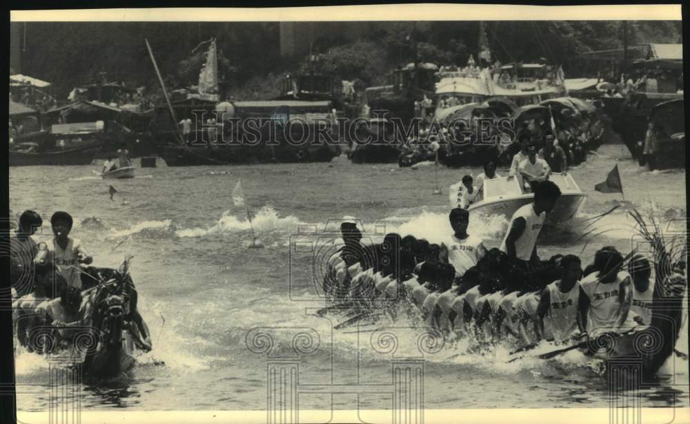 1986 Boats compete during Hong Kong's Dragon Boat Festival - Historic Images