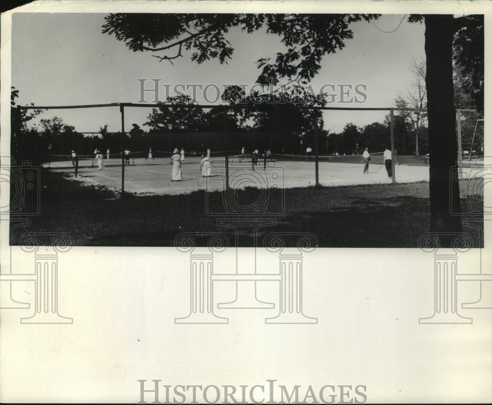 1914 People play tennis at the Lake Park tennis courts - Historic Images