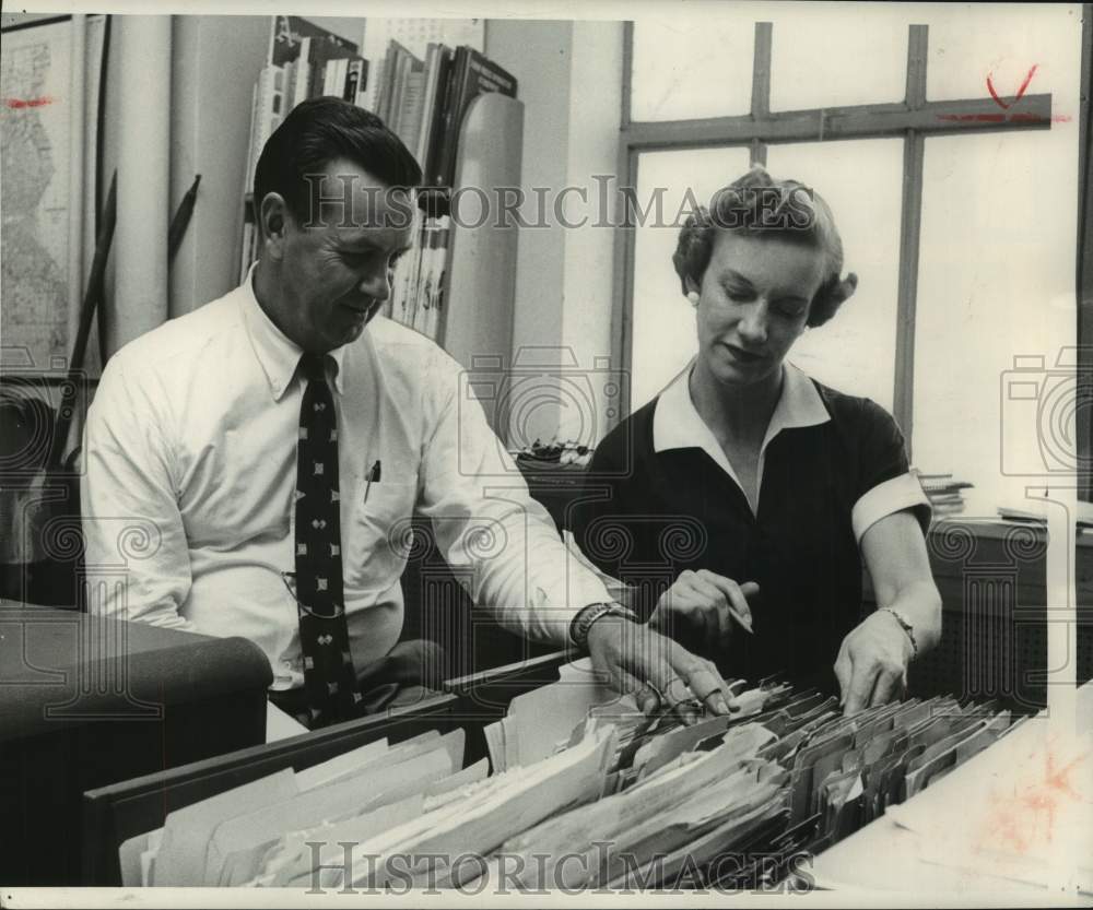 1955, Clifford Larson and Pat Rohrbacher do research at The Journal. - Historic Images